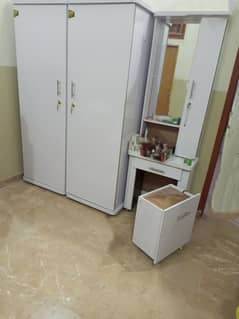 white customized cupboard and dressing with storage seat