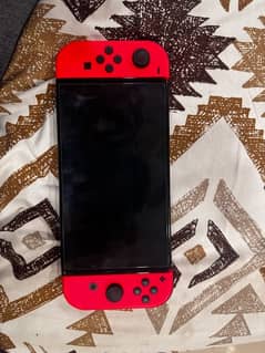 Nintendo Switch Oled along with 7 games.