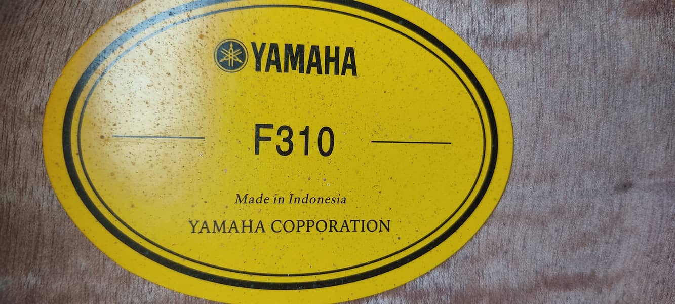 Yamaha F310 acoustic guitar 9