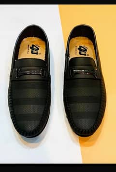 man's black loafers