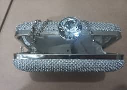 A silver Clutch for sale