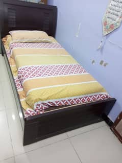 A leminated like new single bed with matress