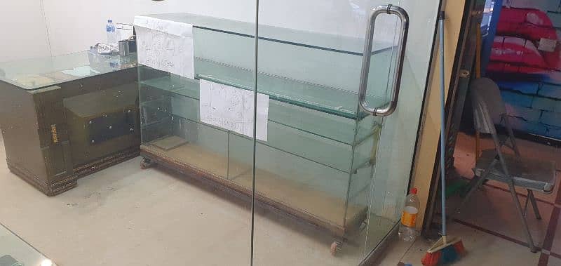 Glass Counter for sale  with iron stand & wheel 1