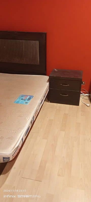 wooden bed with mattress 0