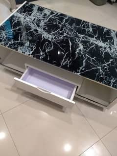 Coffee Table With a Black Marble-patterned Glass Top