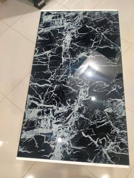 Coffee Table With a Black Marble-patterned Glass Top 1