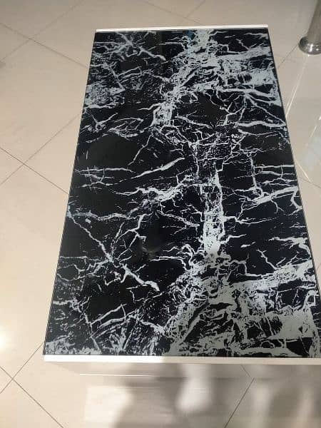 Coffee Table With a Black Marble-patterned Glass Top 3