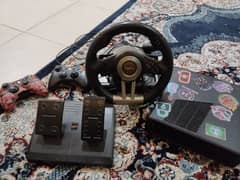 Xbox with steering wheel and 2 controllers