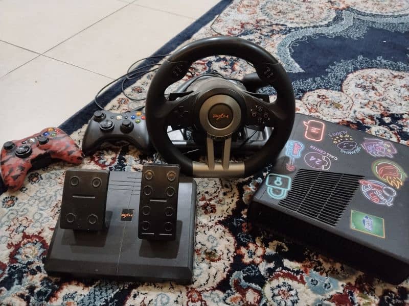 Xbox with steering wheel and 2 controllers 0