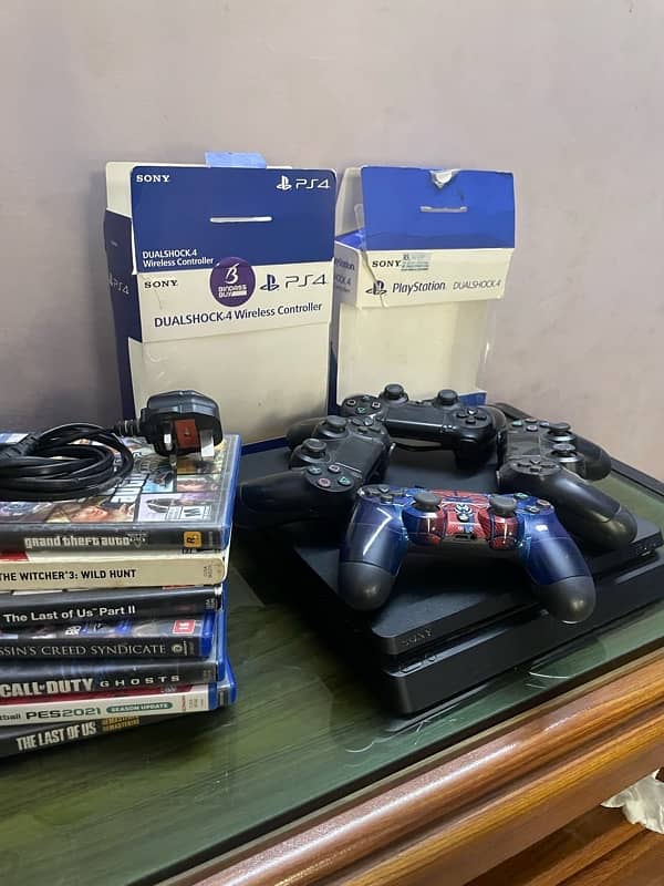 PS4 Slim with 4 controllers and 7 Cd’s. 1