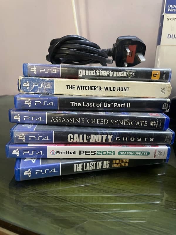 PS4 Slim with 4 controllers and 7 Cd’s. 2