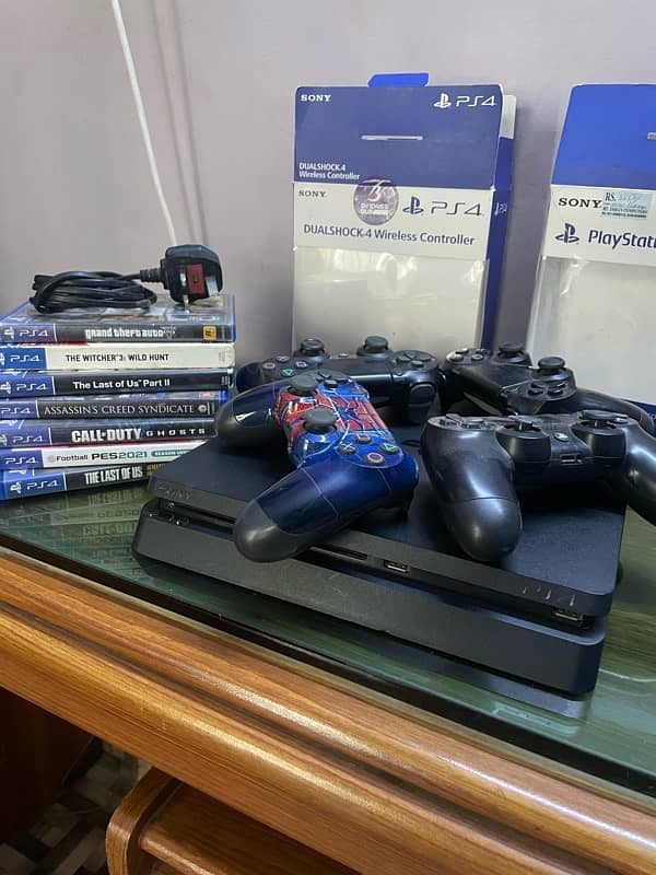 PS4 Slim with 4 controllers and 7 Cd’s. 3