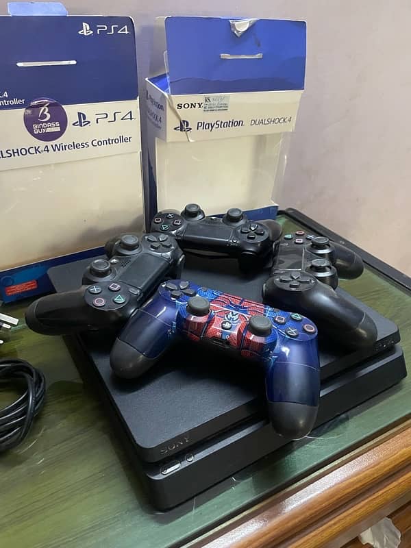 PS4 Slim with 4 controllers and 7 Cd’s. 4