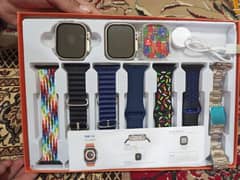 TWO SMART WATCHES with 7 seven strapes BOX PACK WITH CHARGE/Cover