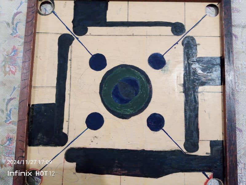 vary good carrom board with coins and strikers,good quality,sports 0