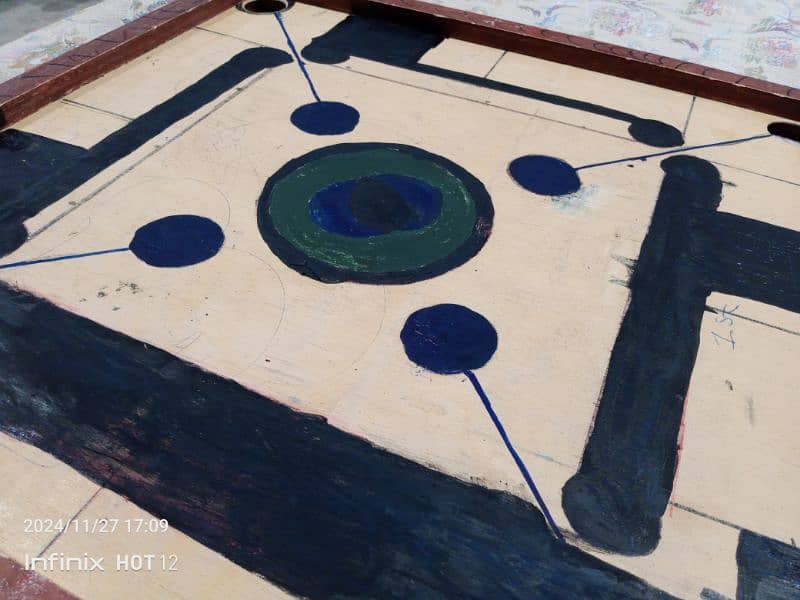 vary good carrom board with coins and strikers,good quality,sports 1