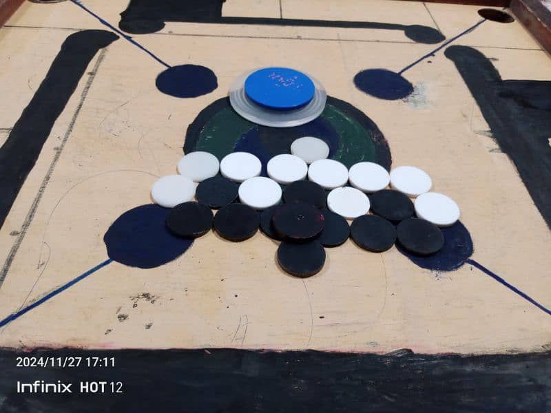 vary good carrom board with coins and strikers,good quality,sports 2