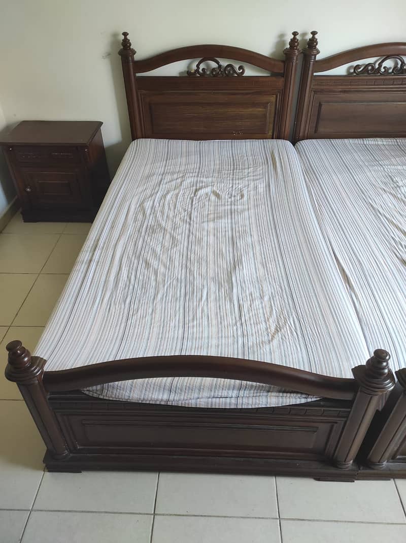 Urgent- 2 single bed 1 side table. Shesham Solid wood. Selling cheap 2