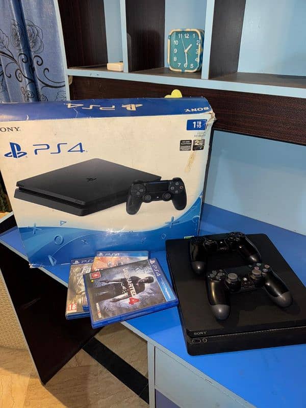 Ps4 slim 1tb . . . with 2 original controller  and 3 games . . . 0