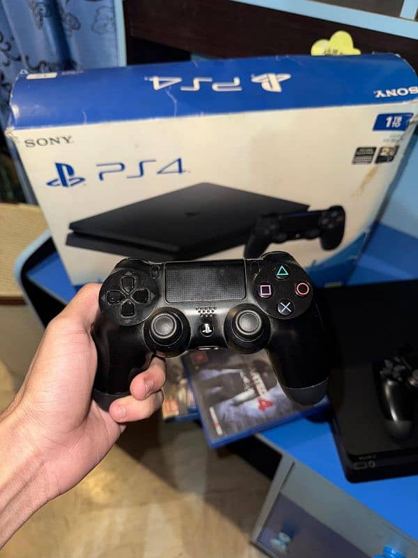 Ps4 slim 1tb . . . with 2 original controller  and 3 games . . . 1