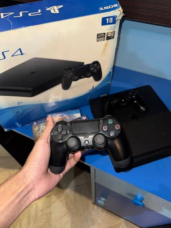 Ps4 slim 1tb . . . with 2 original controller  and 3 games . . . 2