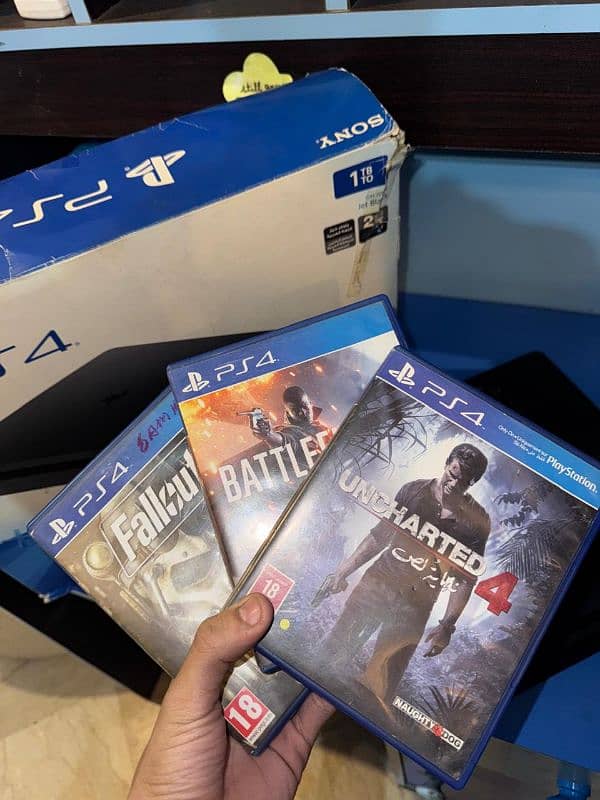 Ps4 slim 1tb . . . with 2 original controller  and 3 games . . . 3