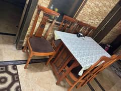 Brand new Glass dining table with 6 velvet seated chairs in 60k