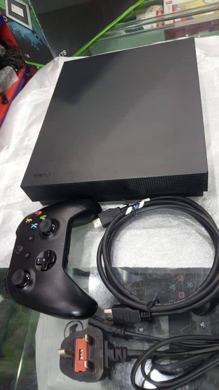 Xbox one x with 2 controllers and 14 day free game pass 1