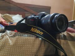 Nikon D3100 with 200mm zoom lens