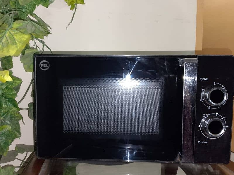 microwave oven new condition ha 9 months use ha bas 0