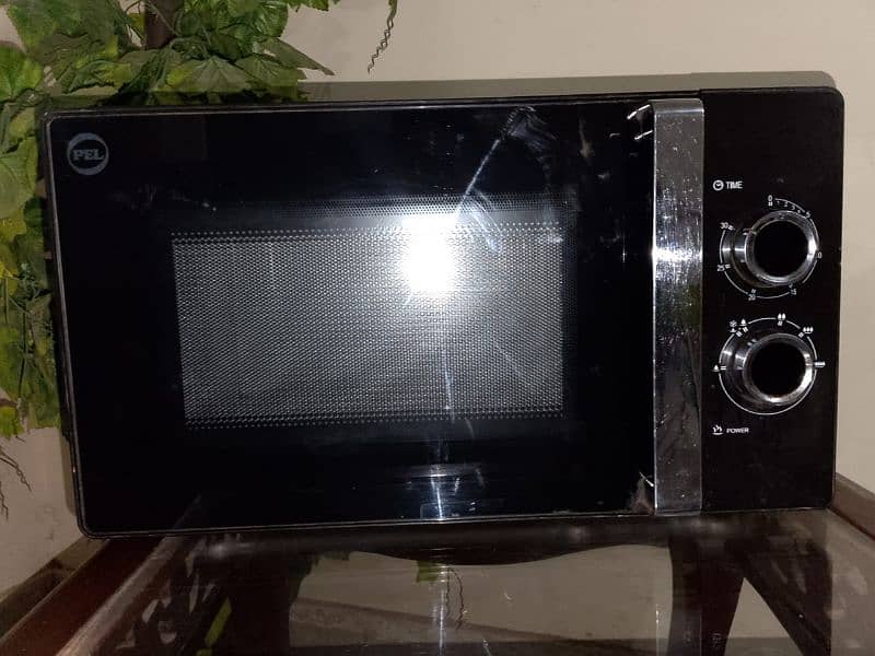 microwave oven new condition ha 9 months use ha bas 2