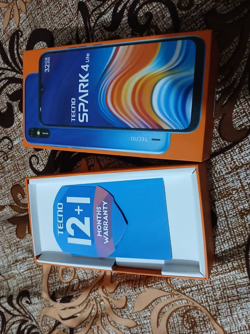 Tecno spark 4 lite phone with kit 1