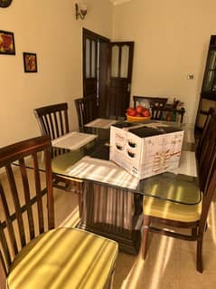 Glass table with wooden chairs