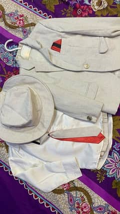 cream suit with pants and hat