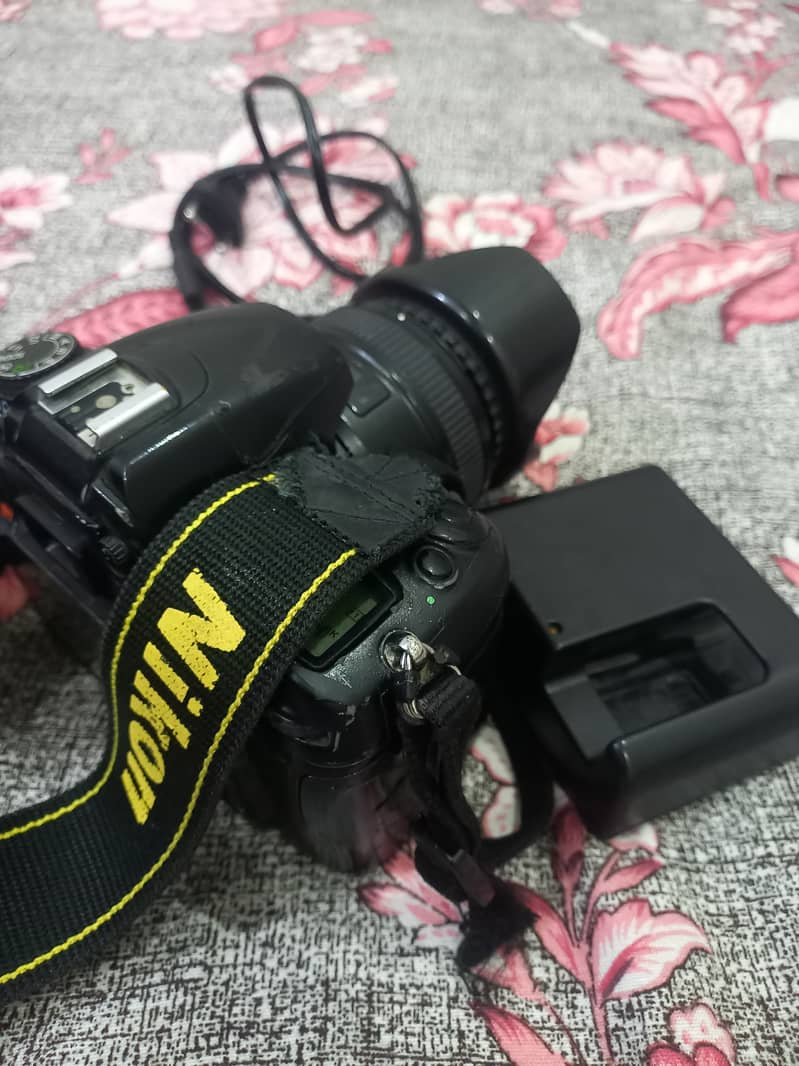 DSLR Nikon D7000 with 50mm-1.8 lens and complete accesories. 1