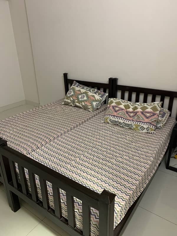 wooden single bed set in very good condition with mattress 0