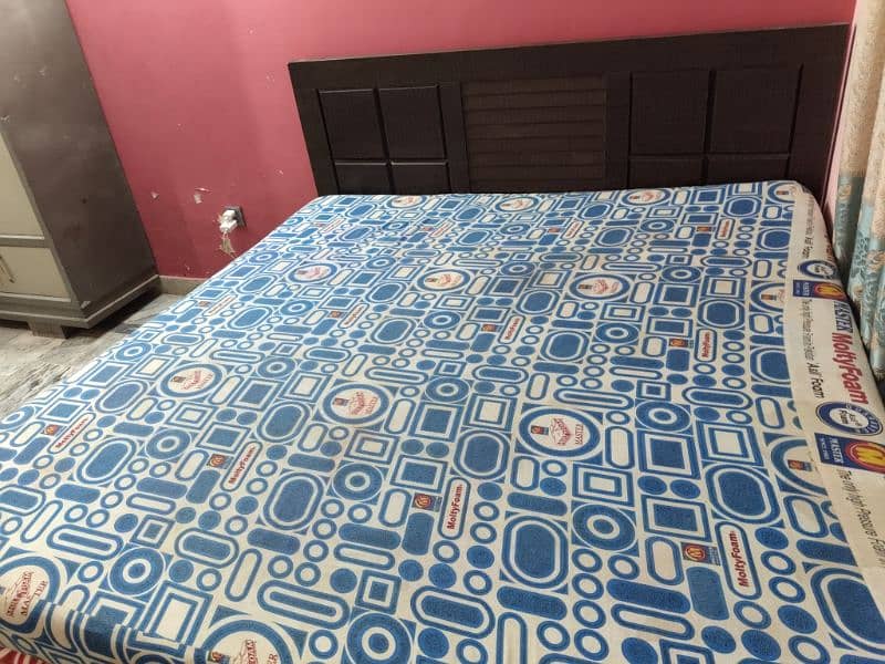 King size wooden bed with molty mattress. good condition. 1