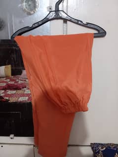 used like new orange frock and truoser