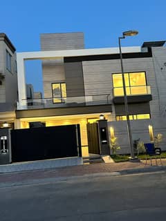 Ten Marla brand new luxury house at prime location of Overseas A block within walking distance from Mosque, Park and Market in Bahria Town Lahore