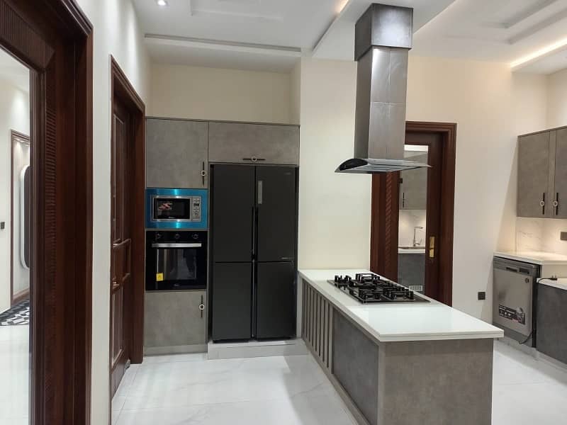 One Kanal Ultra Luxury Modern Double Height Lobby Semi Furnished House With Eight Inverter AC, Two Door Inverter Refrigerator And MWO Installed At Prime Location Of Jasmine Block Secter C Bahria Town Lahore 11