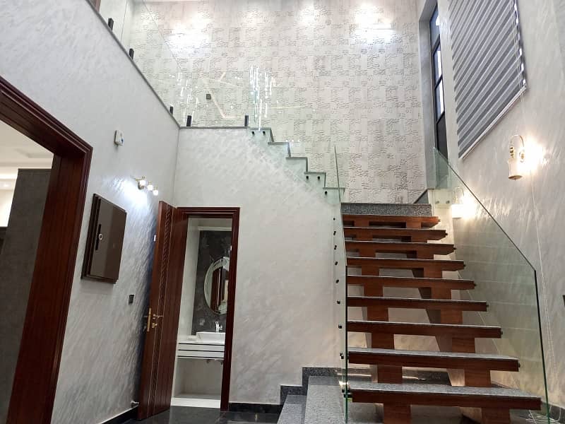 One Kanal Ultra Luxury Modern Double Height Lobby Semi Furnished House With Eight Inverter AC, Two Door Inverter Refrigerator And MWO Installed At Prime Location Of Jasmine Block Secter C Bahria Town Lahore 17