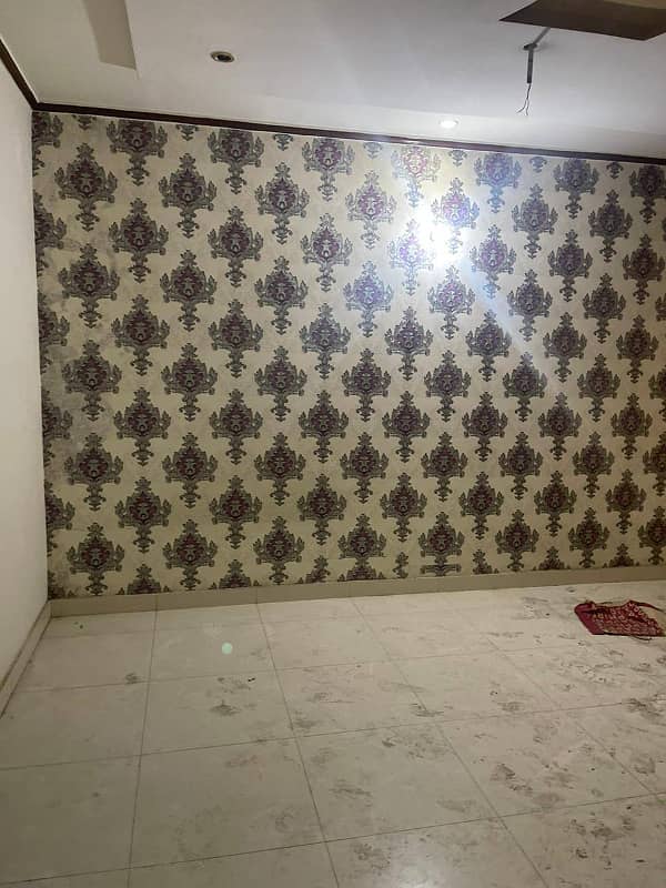 10 Marla Tile Upper portion is For rent in wapda town Block J2. 11