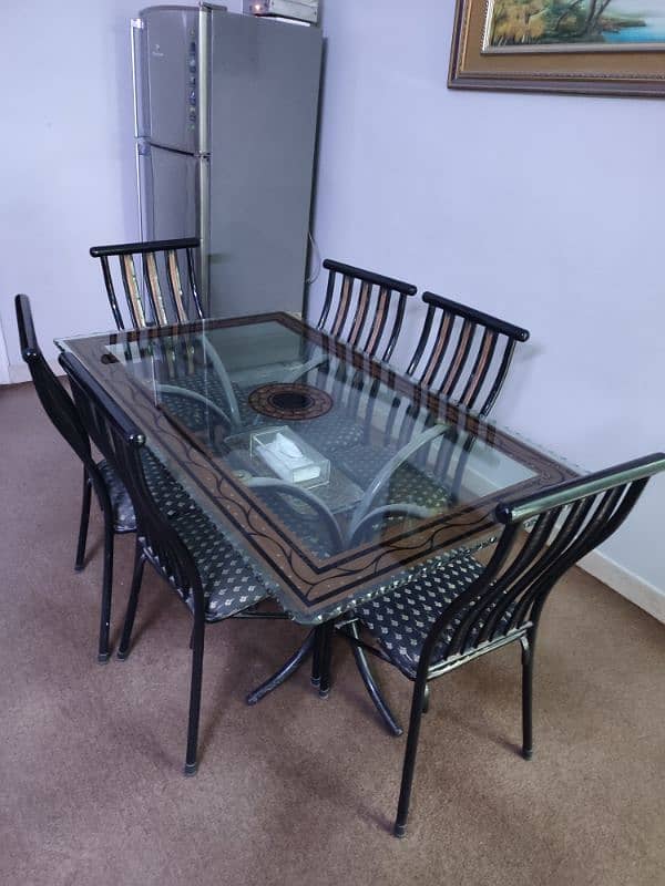 6 seater dining table | iron stand | thick glass | good condition 0