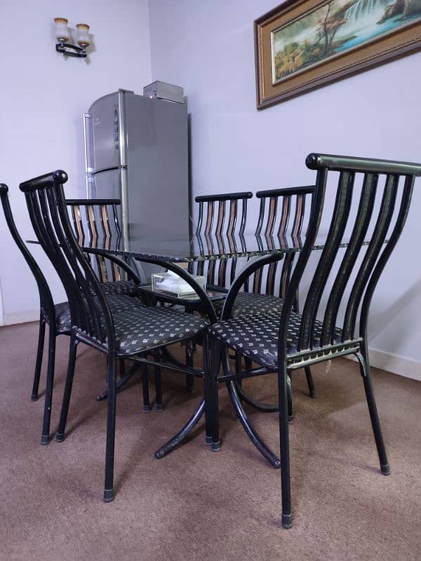 6 seater dining table | iron stand | thick glass | good condition 1