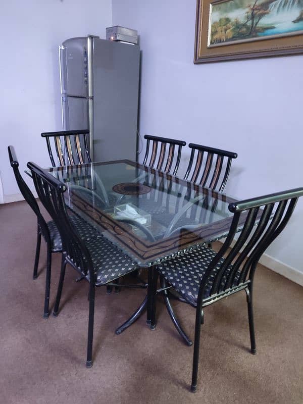 6 seater dining table | iron stand | thick glass | good condition 2