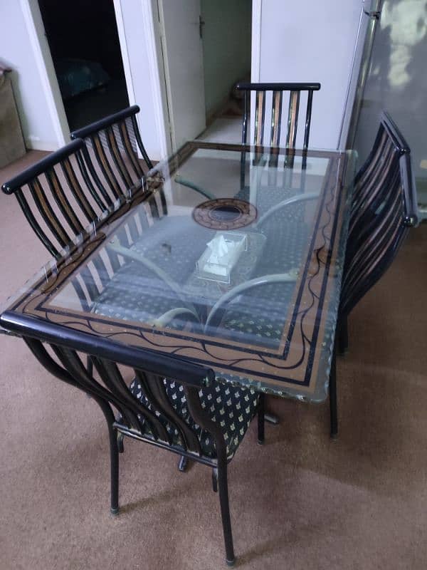 6 seater dining table | iron stand | thick glass | good condition 4