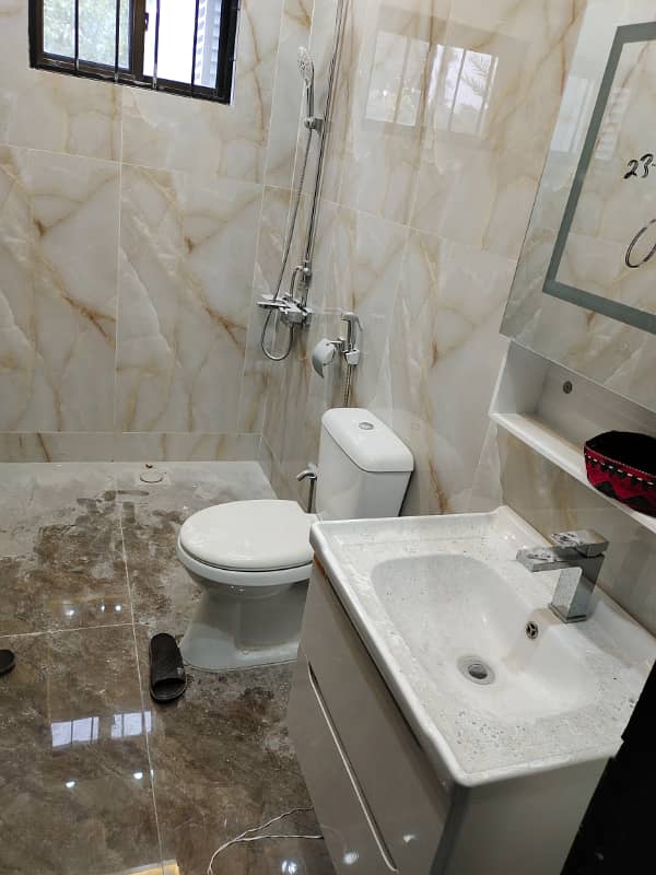 Beautiful kanal triple story full house available for rent in f-10 Islamabad at big street, 9 bedroom with bathrooms, drawing dining TVL car porch, near to park, near to markaz. 12