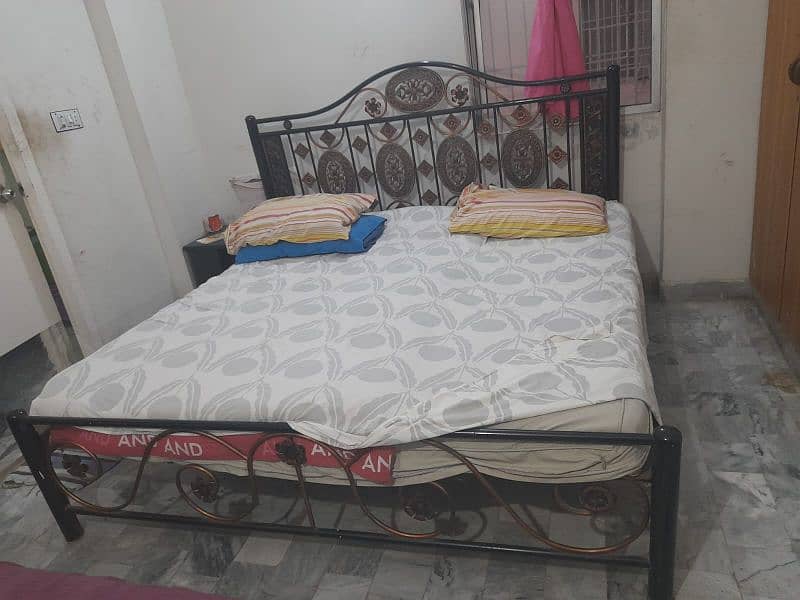 iron bed and single wooden bed 1