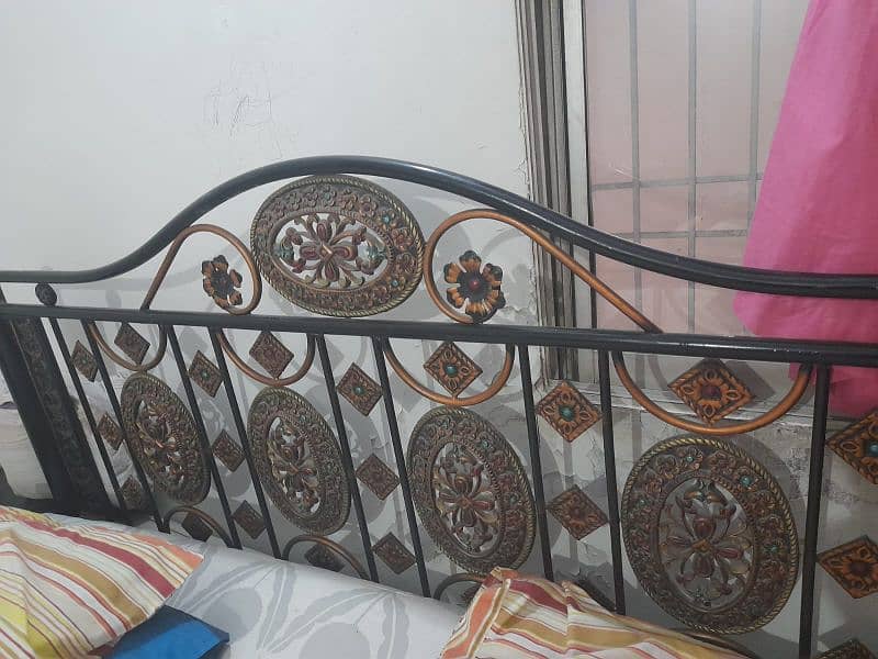 iron bed and single wooden bed 2