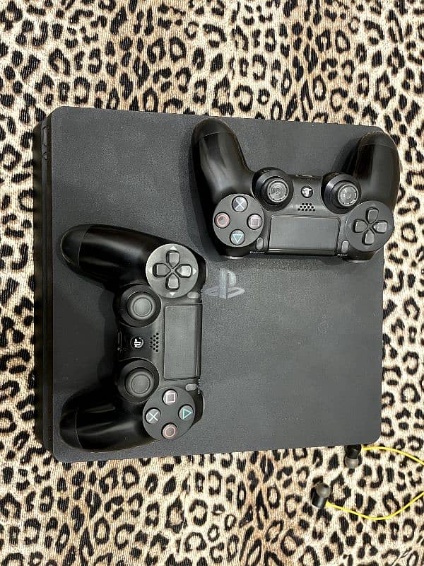 PS4 Slim 500GB With Two Controllers and Four Games 18